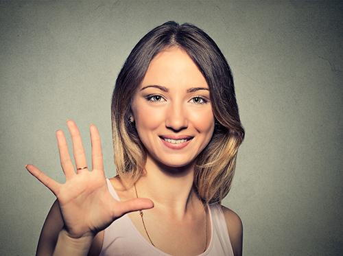 Woman doing five hand sign