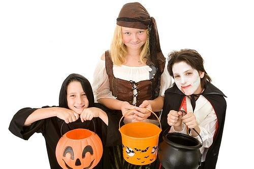 Kids wearing halloween costumes