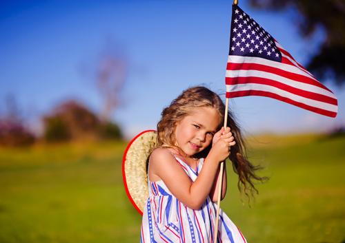 Girl holding USA flag
